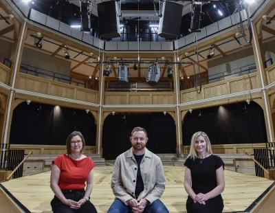 Image of Eleanor Blackburn, Warrington Borough Council, Jimmy Fairhurst, Not Too Tame, and Claire Wills, Shakespeare North Playhouse, sitting near the stage at the playhouse.