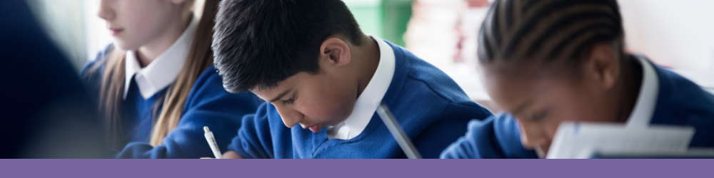 Photo of young people working in a classroom