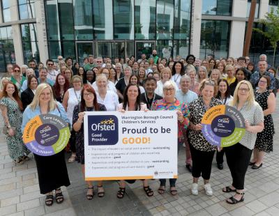 A photo of children's services colleagues outside 1 Time Square celebrating the Ofsted good rating